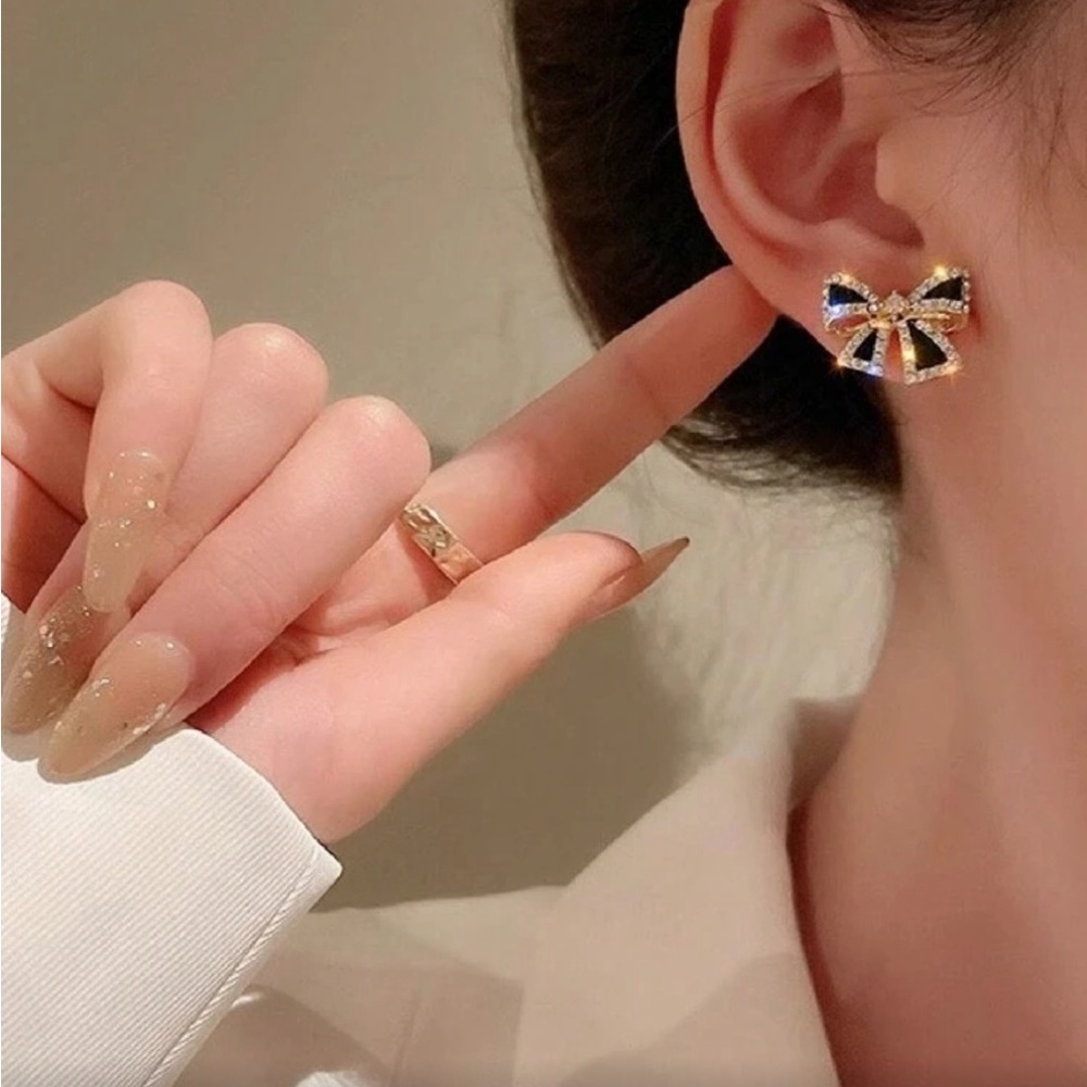 Elegant Bow Earrings with Gold and Black Accents